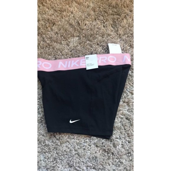 Black nike pro shorts with cheap pink band